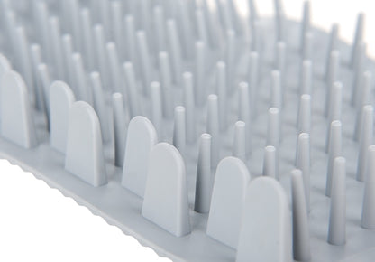 Gros plan des brosses souples du CleanPattes